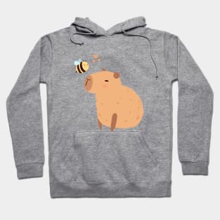 Cute capybara with a bee illustration Hoodie